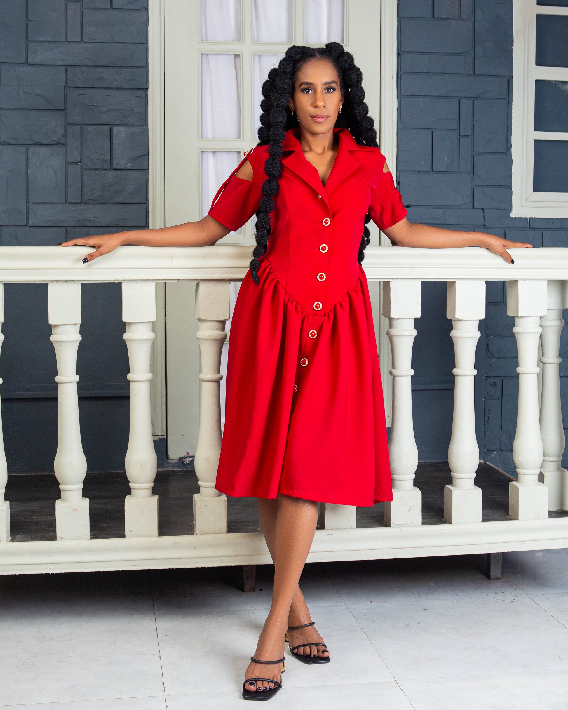 Women wearing a stylish red button down midi dress