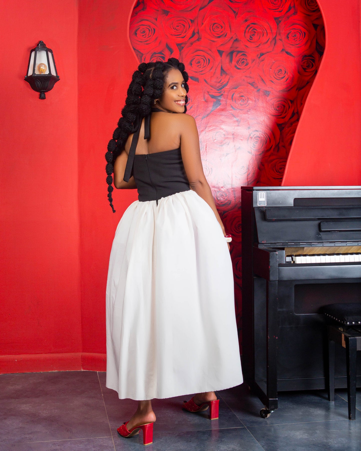 Woman wearing a halter A-line midi dress