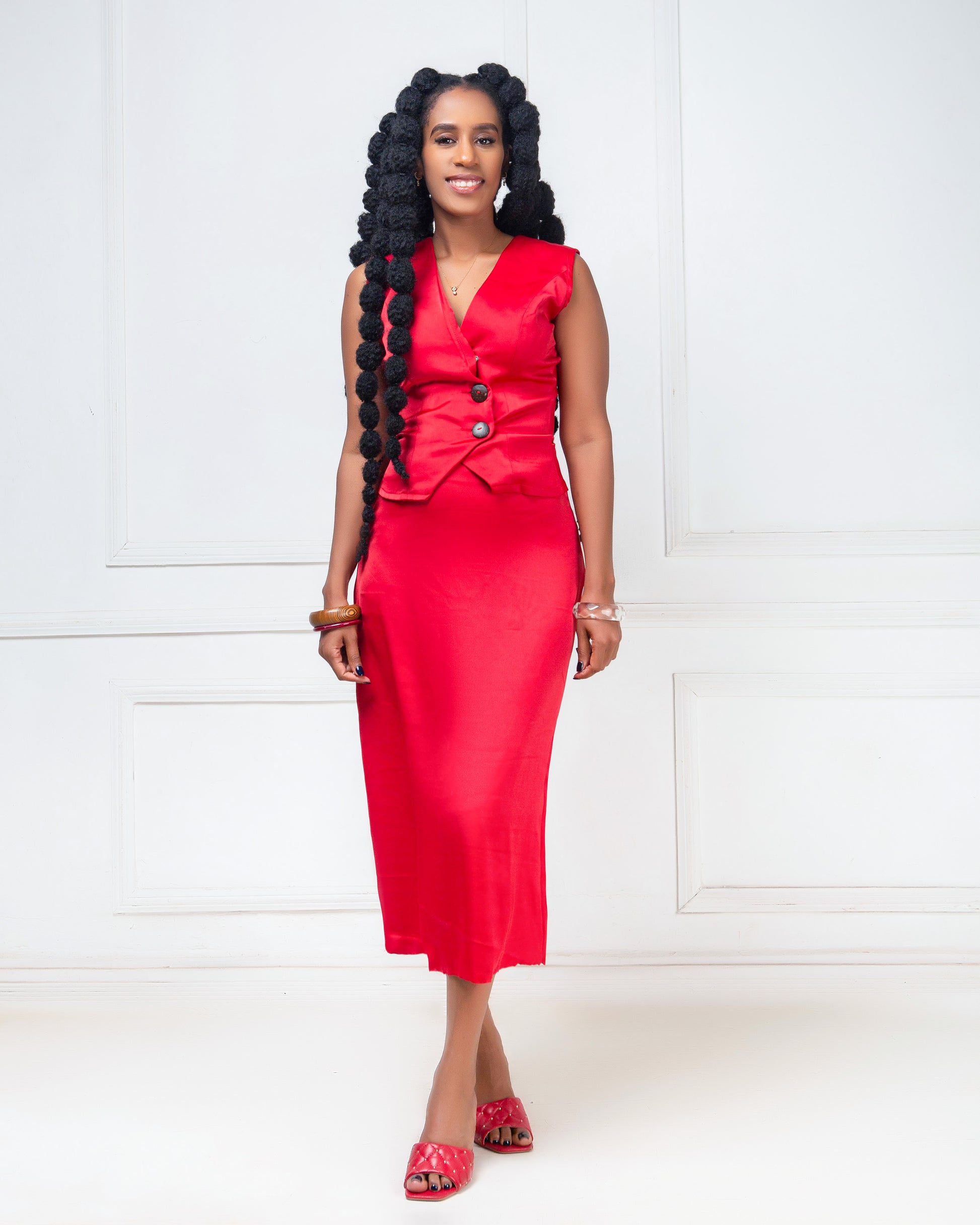 Woman wearing a red two -piece skirt set